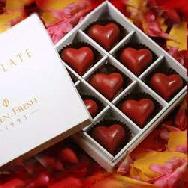 Box of 9 Heart shaped chocolate filled with rasberry