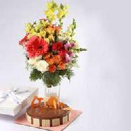  Caramel Panacotta Cake 500gms , Box of 12 pralines & Flower Bouquet on vase