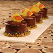 Pistachio creme Brulee with Dark Chocolate mousse & almond Dacquoise
