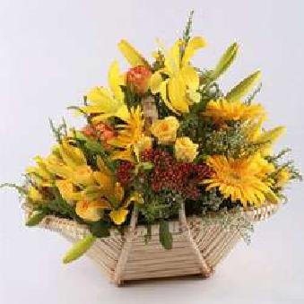 basket of yellow  coloured different  flowers 